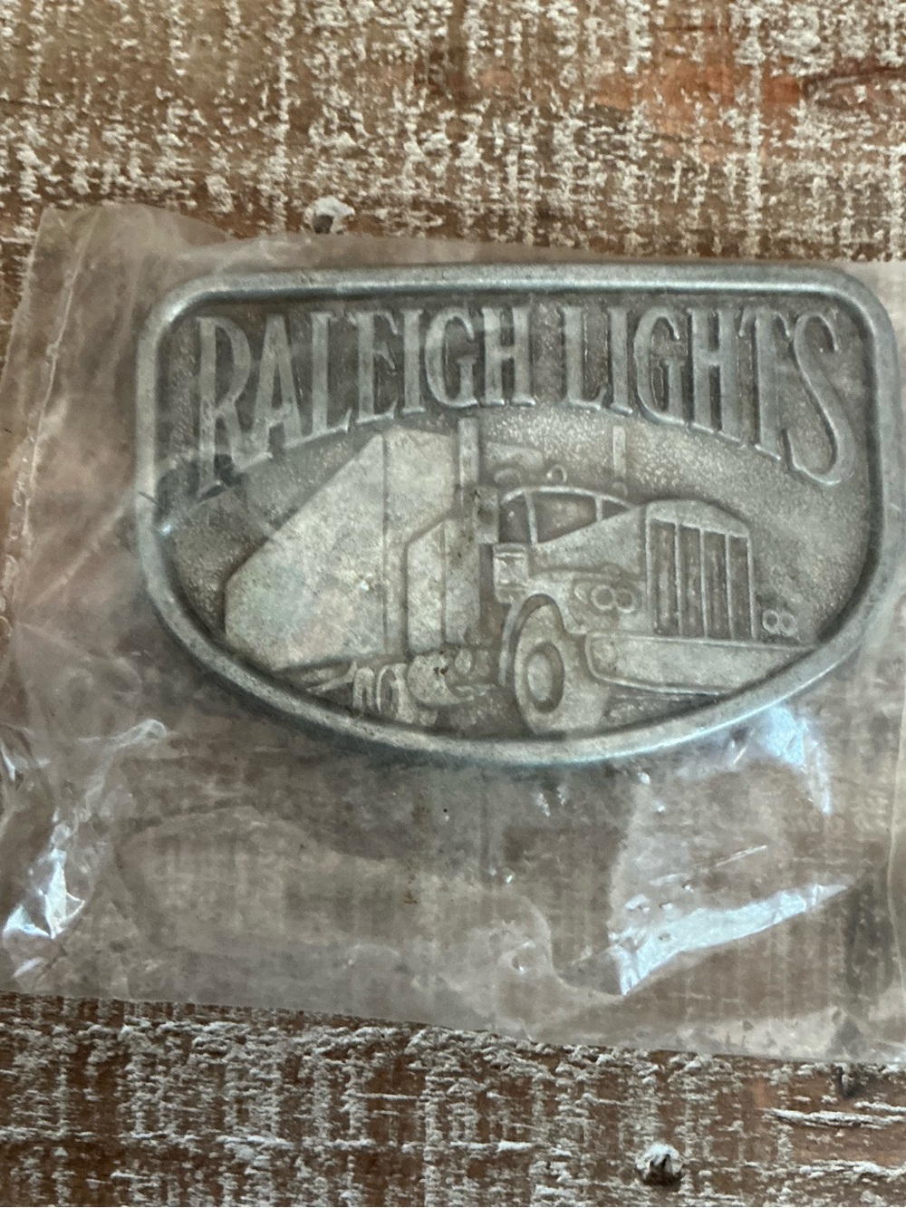Raleigh Lights Embossed Truck Belt Buckle - Silver Tone